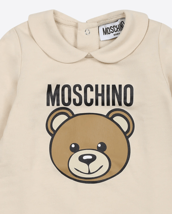 MOSCHINO TUTINA BEIGE PER NEONATI CON TEDDY BEAR E LOGO